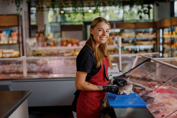 istock A Cheerful Smiling Worker in a Modern Grocery Store Deli Providing Excellent Service and Quality 2183158490