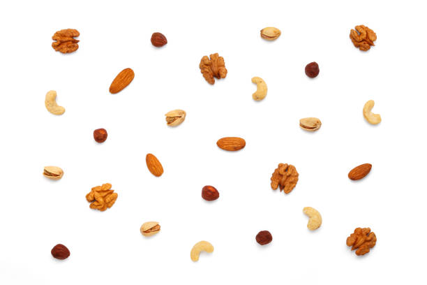 istock Background from different types of nuts and seeds. Isolated on white background 2183158916