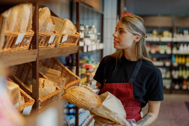 istock A Skilled Baker Proudly Displaying Freshly Made Artisan Bread in a Warm and Cozy Bakery 2183159061