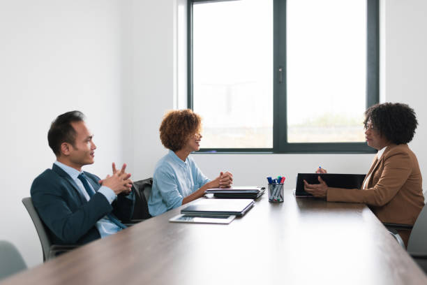 Three People in a Business Meeting