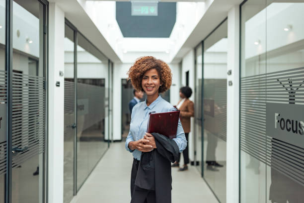 istock Professional Woman in Modern Office Hallway 2183159410