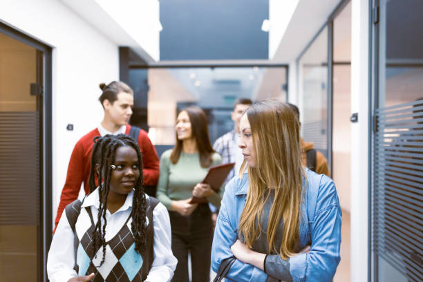 istock Young Professionals Walking in Office Corridor 2183159485