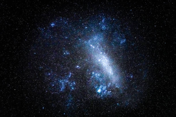 The beautiful country night sky filled with stars and the Large Magellanic Cloud in Blayney, Central West, NSW, Australia.