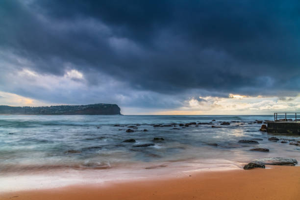 istock Cloud covered sunrise at the seaside 2183160223