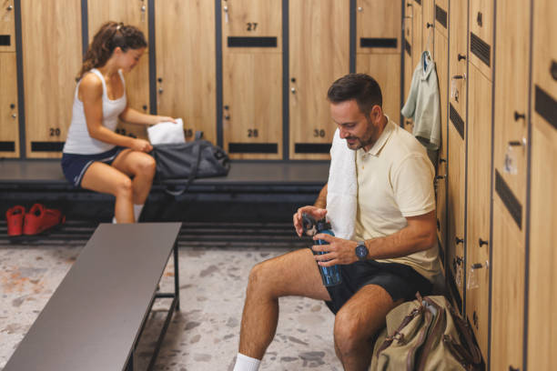 istock Man and woman adjusting gym gear, ready for exercise 2183161899