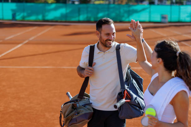 istock Pair high-fiving after a successful tennis match. 2183161945