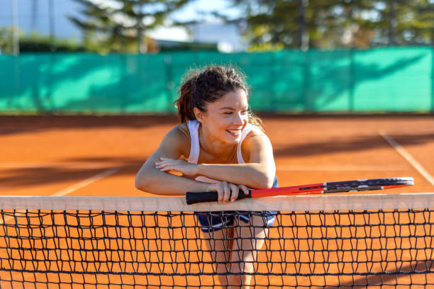 istock Happy tennis player taking a break at the net 2183162138