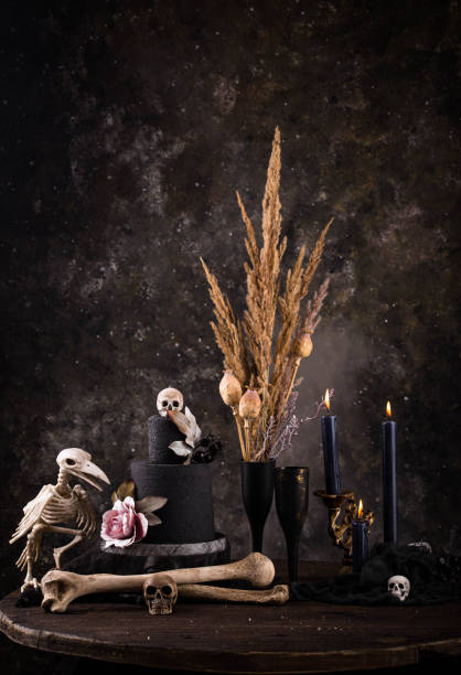 istock Halloween still life with skull, bones and cake 2183164603