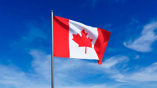 istock Canadian flag waving in the blue sky 2183169206