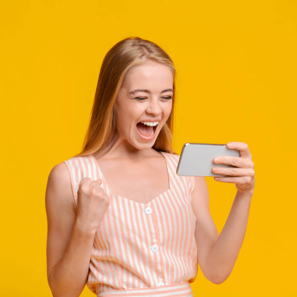 istock Big Win. Overjoyed Young Woman Celebrating Success With Smartphone In Hands 2183177717