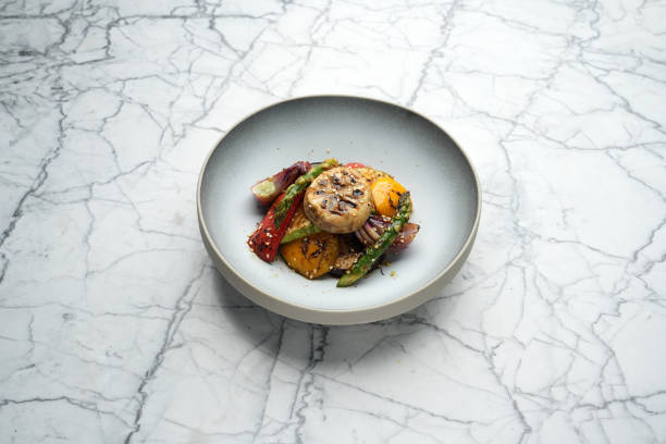 istock Roasted miso vegetables on a marble table background with copy space, close-up. Asian food menu 2183180153