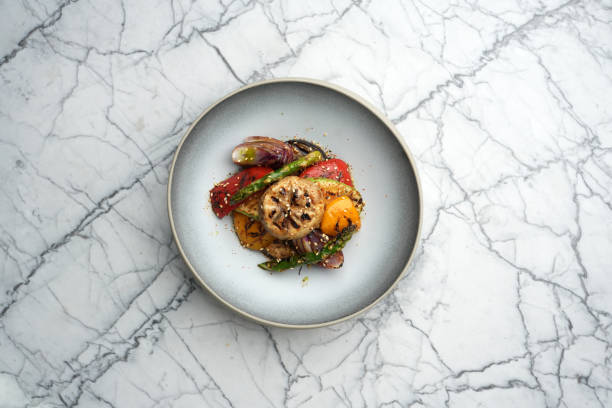 istock Roasted miso vegetables on a marble table background with copy space, close-up. Asian food menu 2183180158
