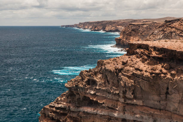 istock Stunning coastal cliffs meet azure waters at Shark Bay, Western Australia during midday 2183188005