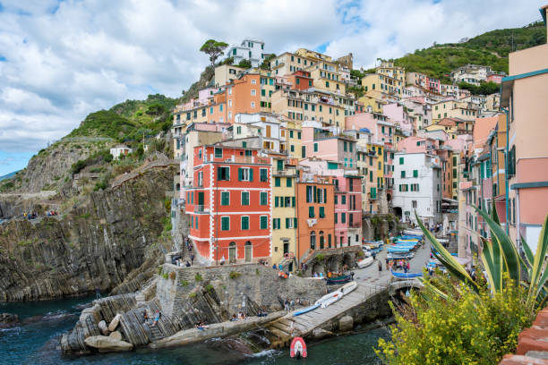 istock Exploring the colorful charm of Riomaggiore, Cinque Terre, under a dramatic cloudy sky 2183188076