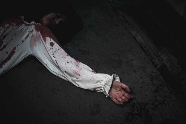 istock Homicide female hands in blood 2183190026