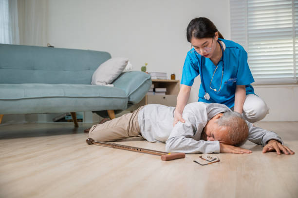 istock Asian older senior man falling down on lying floor and woman nurse came to help support 2183190059