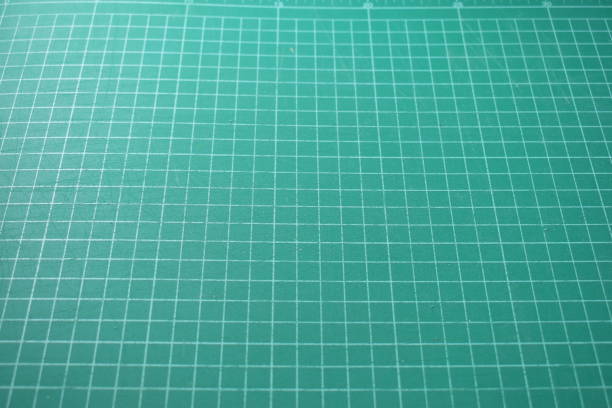 istock green cutting mat board background with line and scale measure guide pattern for object art design, tool equipment of diy craft work 2183191538