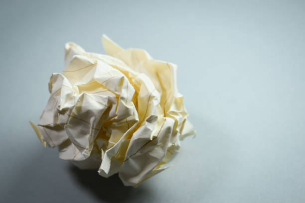 round lump paper on grey background, recycle used paper