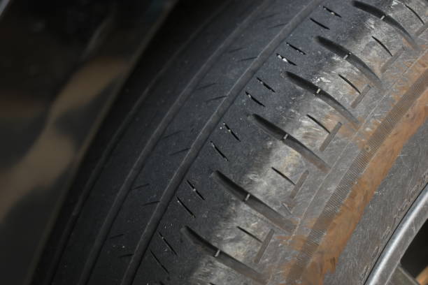 istock dirty black tire car texture, transportation industry 2183192934