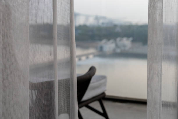 istock chair on balcony, facing the beautiful scenery 2183202236