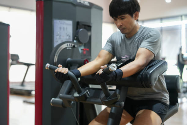 istock Man exercising train your arm muscles in gym. 2183202823