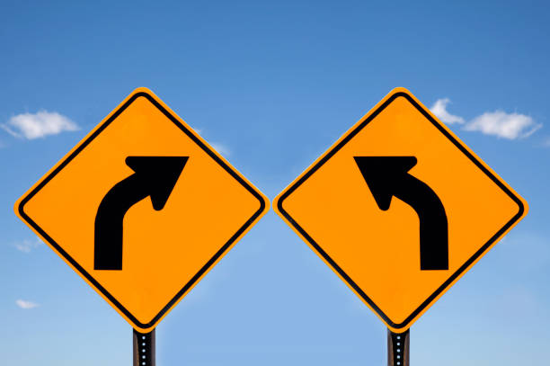 istock sign signs showing opposite direction instructions 2183203238