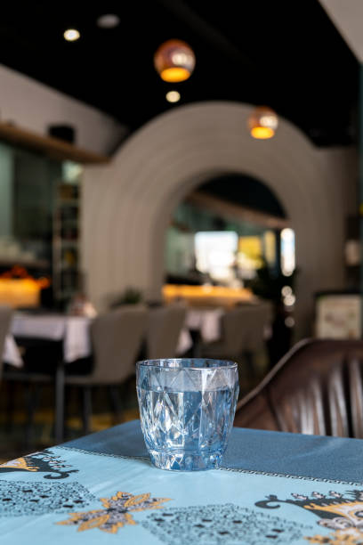 istock glass of water on table in restaurant 2183204746