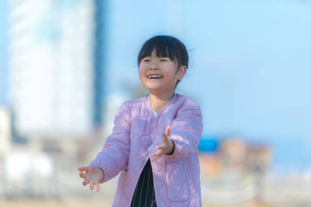Smiling girl playing in the park