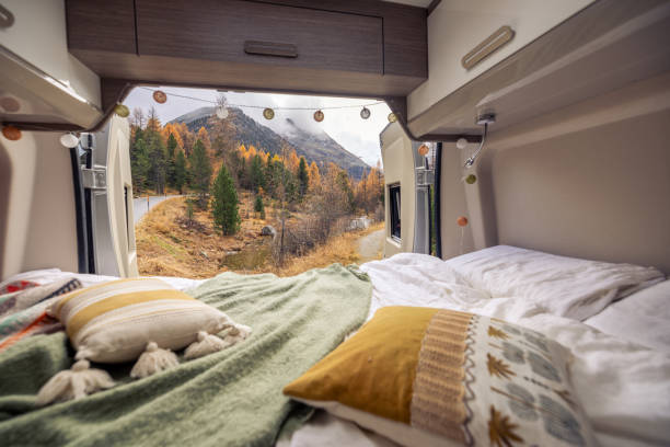 istock Cozy Camper Van Interior with Scenic Autumn Mountain View 2183209977