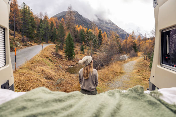 istock Woman Enjoying Autumn Mountain View from Camper Van 2183210043