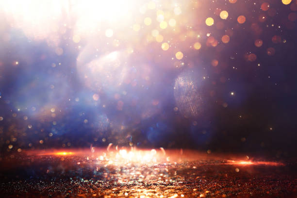 istock abstract glitter black, gold , blue lights background. de-focused 2183210371
