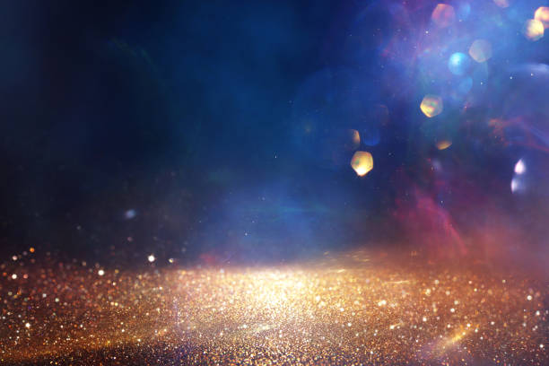 istock abstract glitter black, blue and gold lights background. de-focused 2183210373