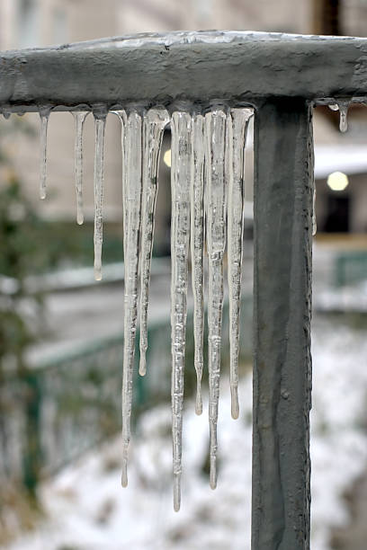 istock Icicles on the metal fence 2183211474
