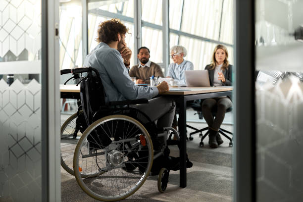 istock Worried candidate in a wheelchair on a job interview. 2183213736