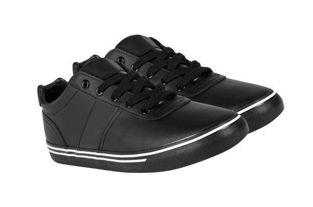 Stylish fashionable black children's shoes, close-up.