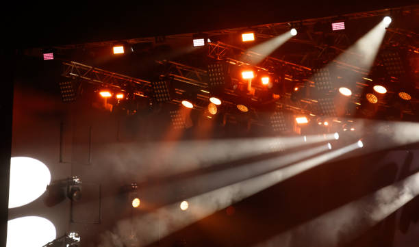 istock Red-orange color on stage at a concert 2183214349