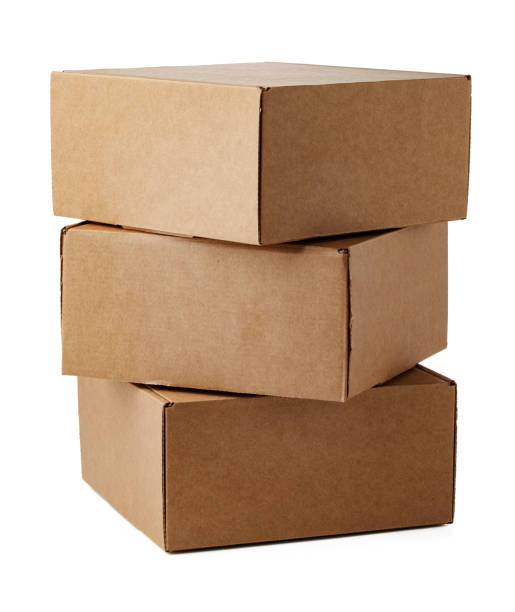 istock Stacked brown cardboard boxes in various sizes arranged on a white background 2183214764
