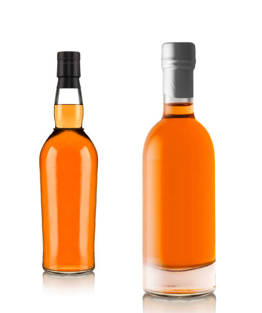 istock Full whiskey bottles isolated on white background 2183216192