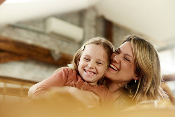 istock Happy single mother and daughter having fun at home. 2183217194