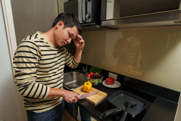 istock tired man with preparing to cooking in kitchen at home 2183217284