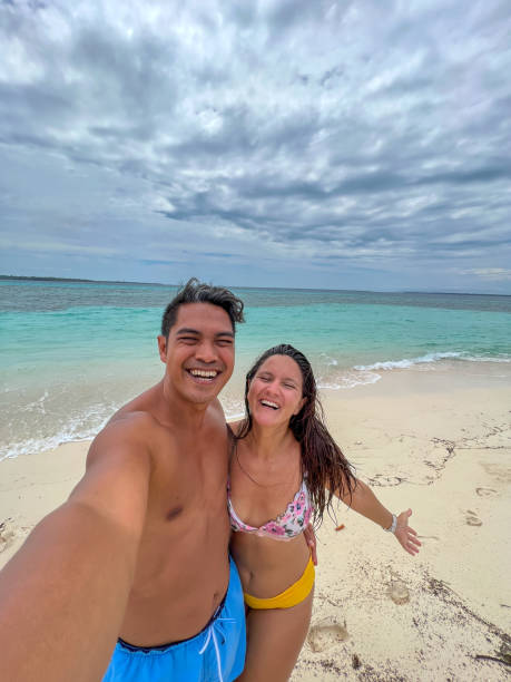 istock Happy Couple Taking a Selfie on Tropical Beach 2183219478