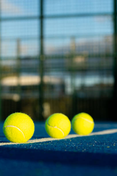 istock three balls in a row on a padel court line at evening 2183220759