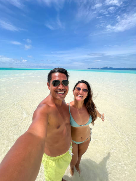 istock Couple Taking a Selfie on a Tropical Sandbar 2183220826