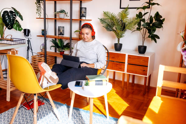 istock Young female adult working home office using laptop tablet 2183223095