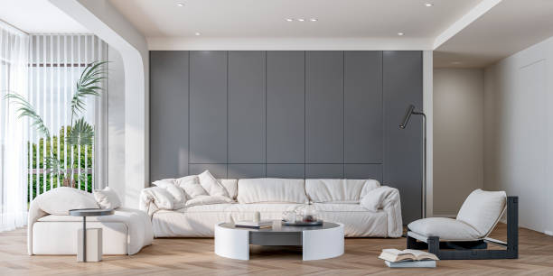 istock A modern, minimalist living room with a sofa and decoration in front of a white and medium gray customized built-in furniture and copy space, a peek of a hallway, large windows with curtains 2183223830