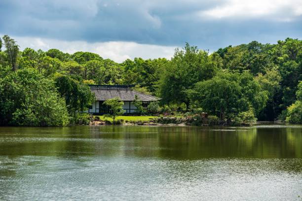 istock Japanese house by a tranquil lake 2183224632