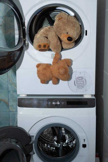 istock Adorable Teddy Bears having fun in the Washing Machine while getting clean and cozy 2183225963