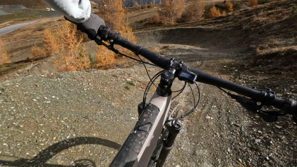 istock POV past mountain bikers handlebars riding trail on mountain 2183226597
