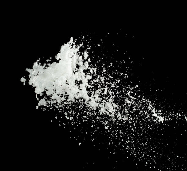 istock Snow dust element falling over dark night. Fluffy White snow splash flying or throwing in mid air. Snowfall on Black background isolated 2183227439