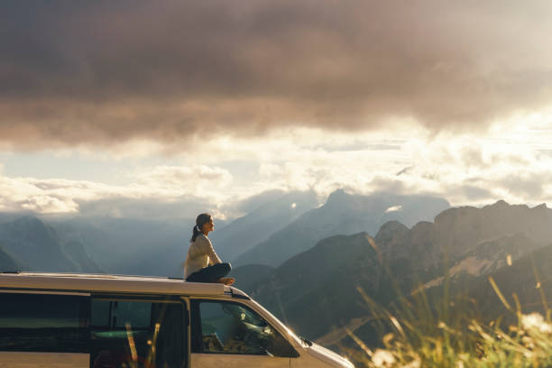 istock Caucasian Woman Enjoys Scenic Mountain View from Campervan 2183229149